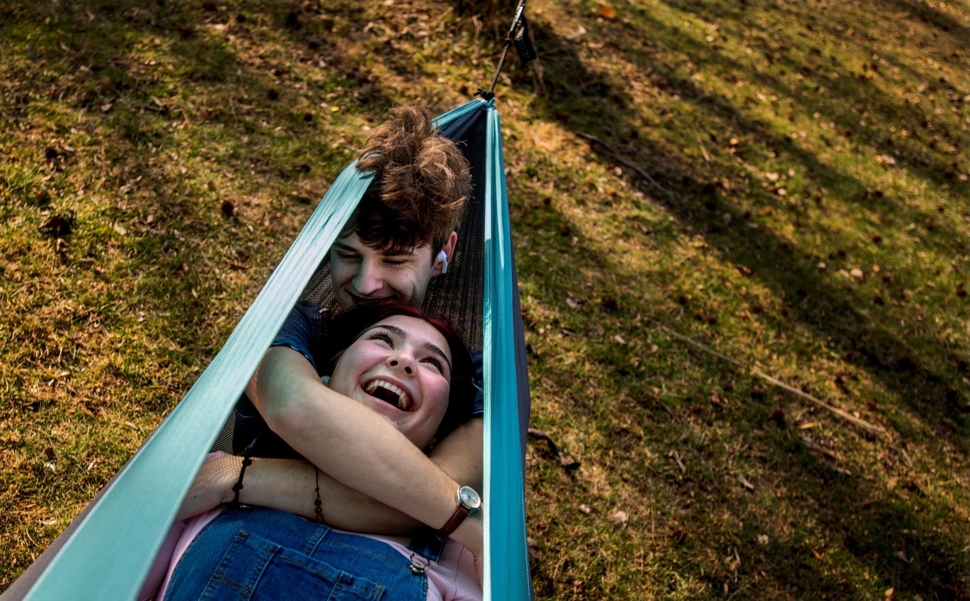 couple laying together in hammock